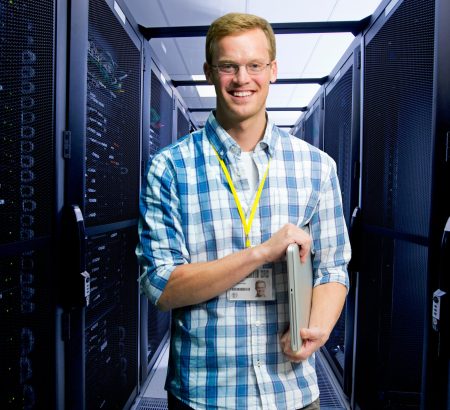 wide-close-shot-of-a-smiling-technician-holding-a-2026-01-11-09-38-14-utc